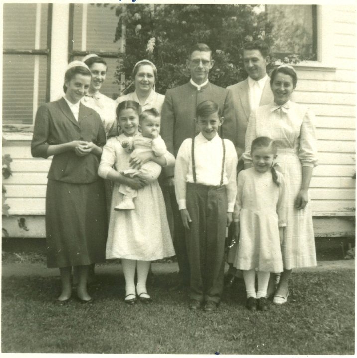 1343B.jpg - The Melvin Schrock Family, 1955.  left back:  Eunice 15, myself, Melvin, Paul 20.  Front:  Melva Anne 13, Rhoda 11 holding John 1yr., Jason 9, Julia 5, Esta 17 standing between Julia & Paul.