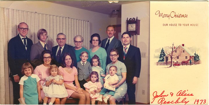 1347A.jpg - John & Alice Reschly Family  Apr 28, 1973.  Back left:  Don Diller, Ken Stauffer, John & Alice Reschly, Linda R. & Delbert Schrock, Alan Mast.  Front left:  Donna, Jane R holding Joann Diller, Lois R. Stauffer, Phillip & Algela Schrock, Anita front pink, Jeannene R. holding Timothy Mast.